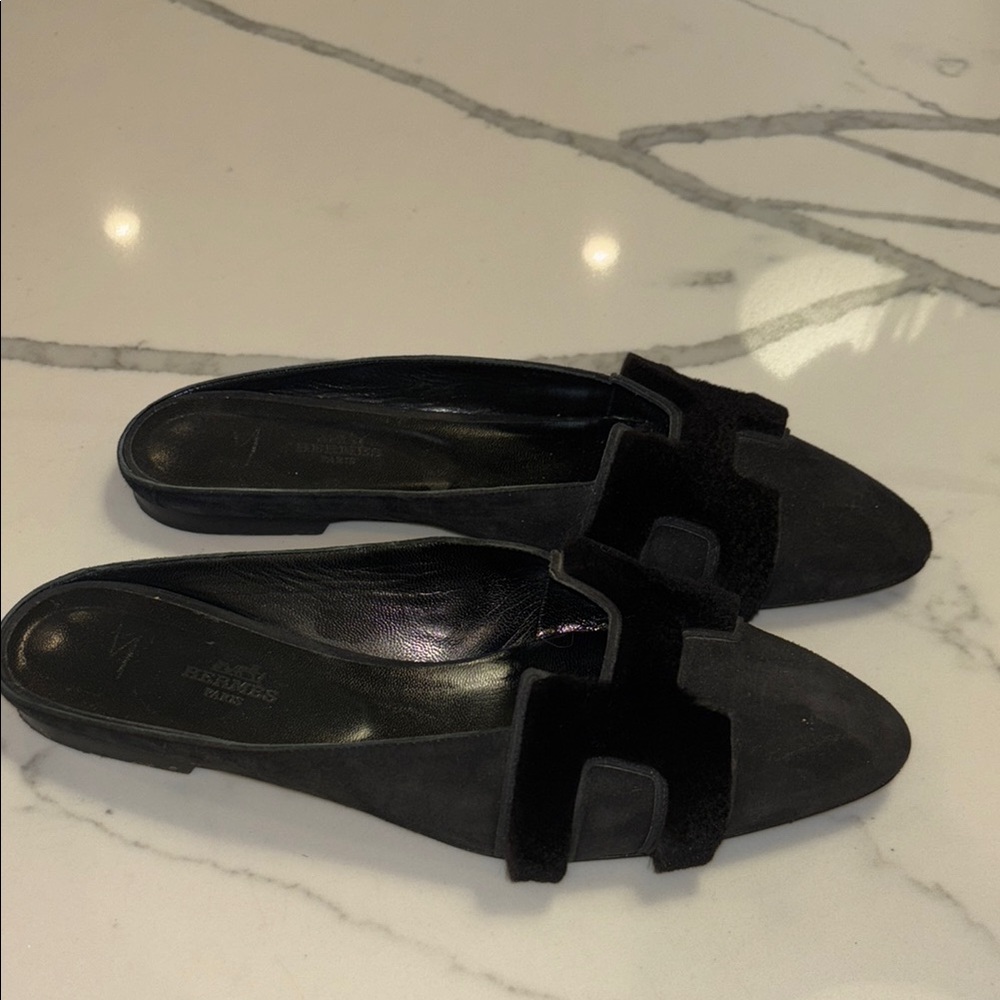 Gently worn Hermes black women slides size 39.5! Black suede with fluffy H